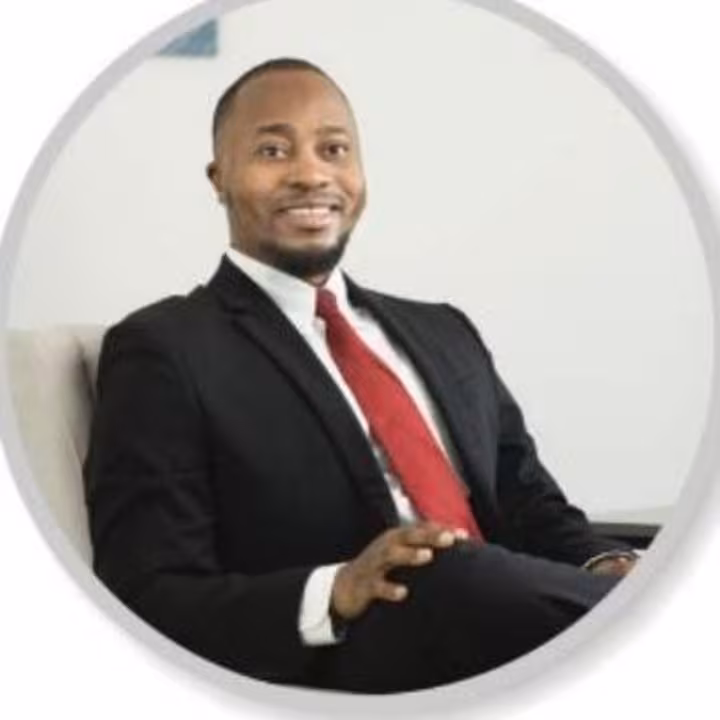 Abraham Ng'hwani, photographed against a light studio background.